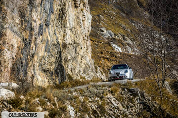 Alfa Romeo Giulietta Veloce – front three-quarter, white against a mountain backdrop
