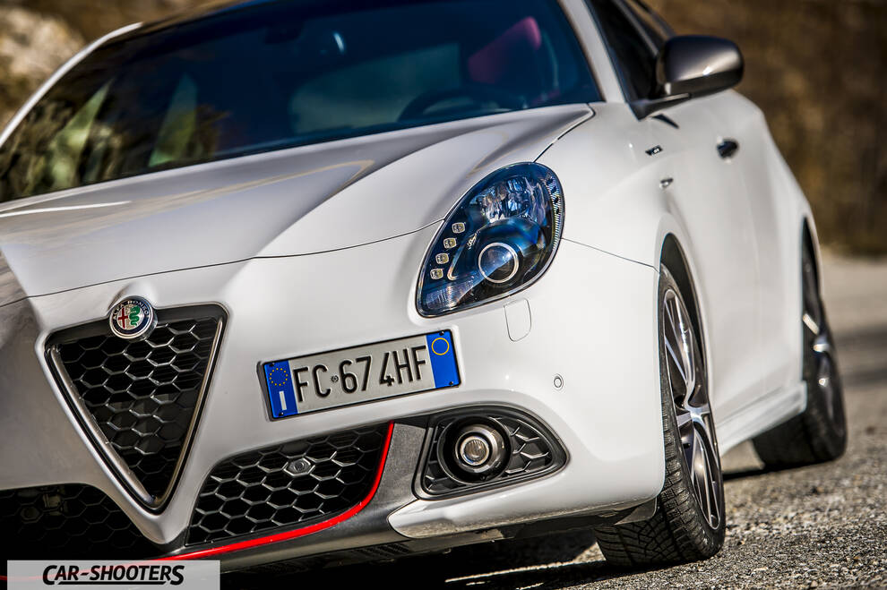 Alfa Romeo Giulietta Veloce – front three-quarter, white against a mountain backdrop
