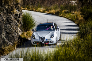 Alfa Romeo Giulietta Veloce – front three-quarter, white on a winding country road