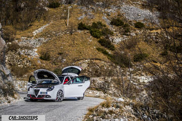Alfa Romeo Giulietta Veloce – front three-quarter, white against a mountain backdrop