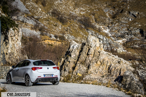 Alfa Romeo Giulietta Veloce – rear three-quarter, white against a mountain backdrop
