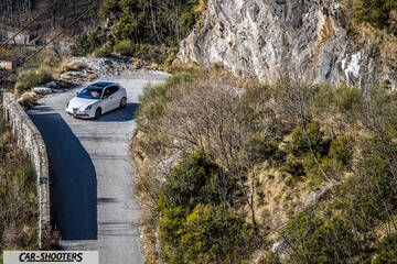 Alfa Romeo Giulietta Veloce – front three-quarter, white against a mountain backdrop