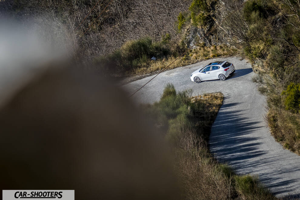 Alfa Romeo Giulietta Veloce – rear three-quarter, white on a winding mountain road