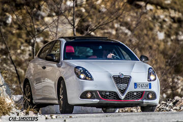 Alfa Romeo Giulietta Veloce – front three-quarter, white against a mountain backdrop