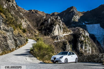 Alfa Romeo Giulietta Veloce – front three-quarter, white against a mountain backdrop