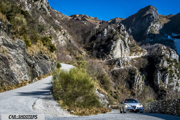 Alfa Romeo Giulietta Veloce – front three-quarter, white against a mountain backdrop