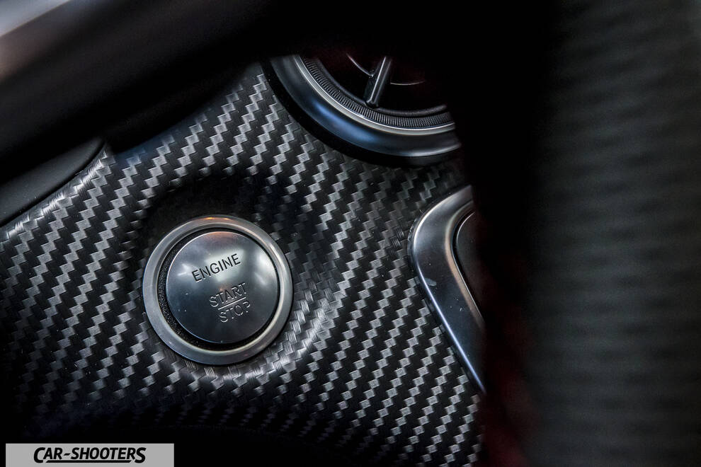Mercedes Benz Classe A Next – detail, carbon fiber start button close-up