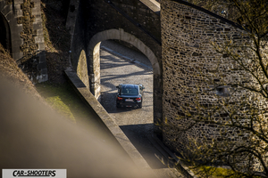 Toyota GT86 Namur – rear view, black driving under stone arches