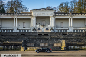 Toyota GT86 Namur – side profile, black in front of a large historic building