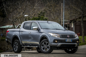Fiat Professional Fullback – front three-quarter, grey metallic on a country road
