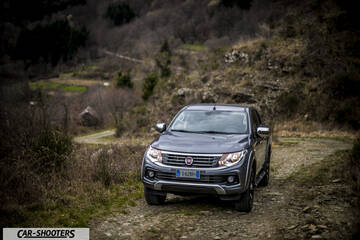 Fiat Professional Fullback – front three-quarter, grey metallic on a dirt road