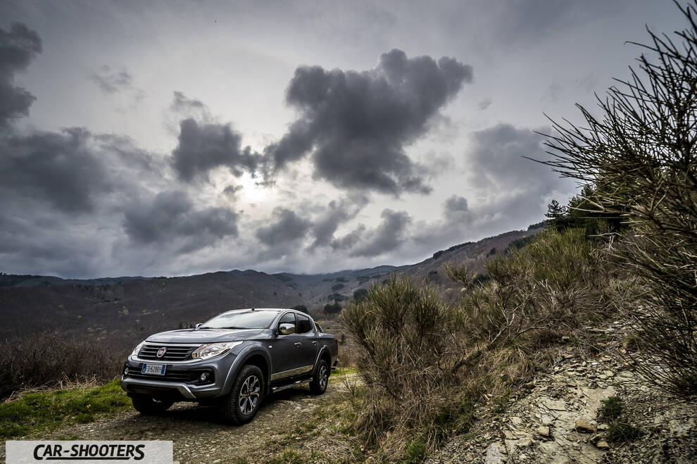 Fiat Professional Fullback – front three-quarter, grey metallic against a mountain backdrop
