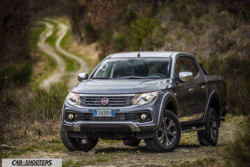 Fiat Professional Fullback – front three-quarter, grey metallic on a country road
