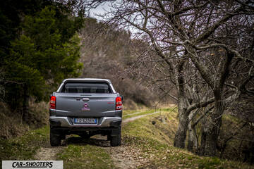 Fiat Professional Fullback – rear view, grey metallic on a dirt road