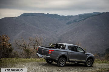 Fiat Professional Fullback – rear three-quarter, grey metallic against a mountain backdrop