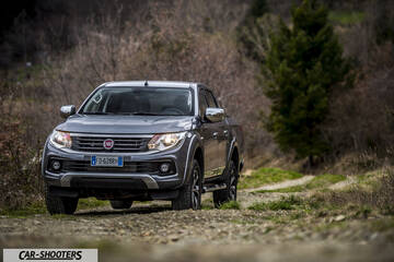 Fiat Professional Fullback – front three-quarter, grey metallic on a dirt road