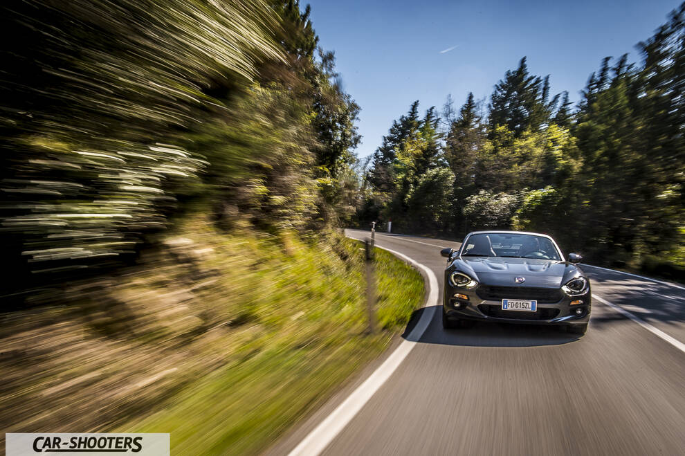 Fiat 124 Spider – front three-quarter, dark grey on a curvy road