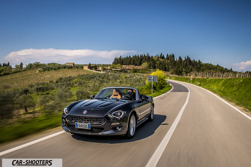 Fiat 124 Spider – front three-quarter, dark grey metallic on a country road