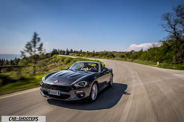Fiat 124 Spider – front three-quarter, grey metallic on a country road