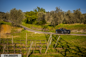 Fiat 124 Spider – front three-quarter, black on a country road