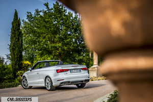 Audi A3 Cabriolet – rear three-quarter, white parked in a courtyard