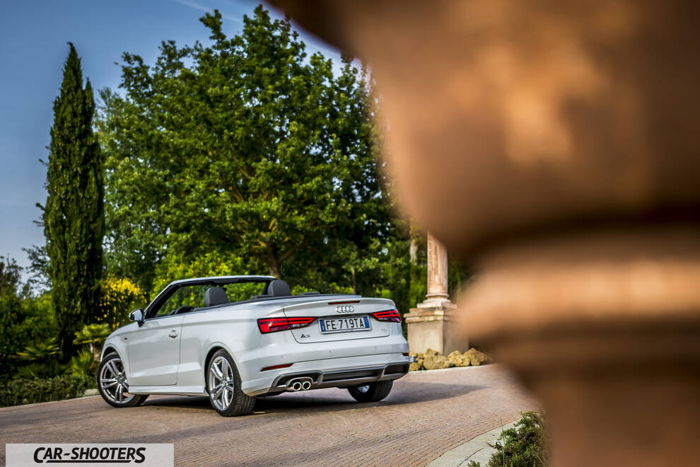 Audi A3 Cabriolet – rear three-quarter, white parked in a courtyard