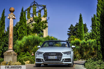 Audi A3 Cabriolet – front three-quarter, silver against a historic garden backdrop