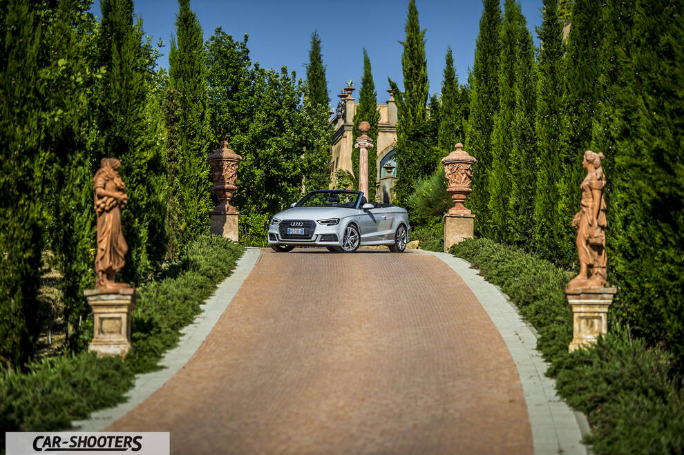 Audi A3 Cabriolet – front three-quarter, silver on a driveway with tall trees