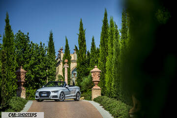 Audi A3 Cabriolet – front three-quarter, silver on a driveway with tall trees
