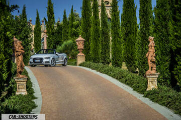 Audi A3 Cabriolet – front three-quarter, silver on a driveway with statues