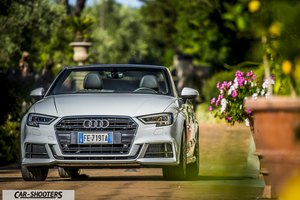 Audi A3 Cabriolet – front three-quarter, silver on a pathway with flowers
