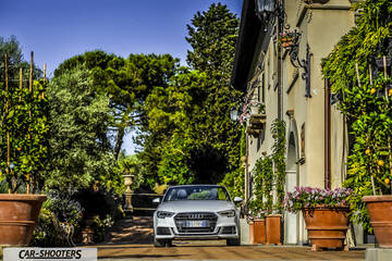 Audi A3 Cabriolet – front three-quarter, silver parked beside a building