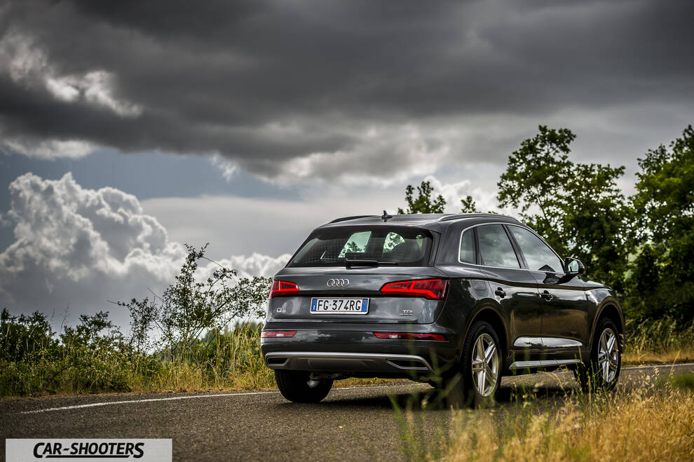 Audi Q5 – rear three-quarter, grey metallic on a country road
