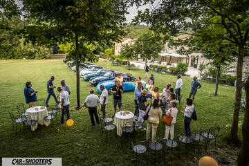front three-quarter, blue at an outdoor gathering on grass