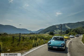 front three-quarter, teal on a country road