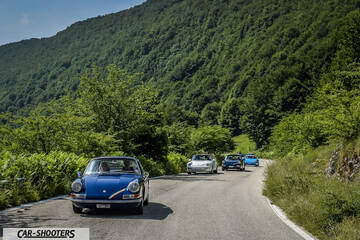 front three-quarter, blue on a mountain road