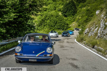 front three-quarter, blue on a mountain road