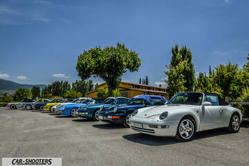 front three-quarter, white in a parking lot