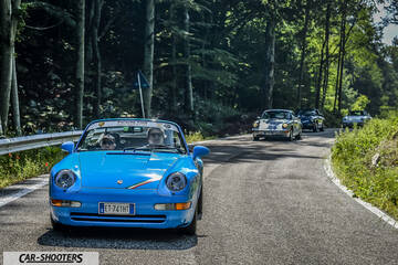 front three-quarter, blue on a country road