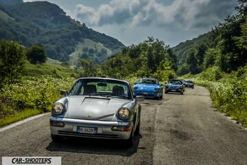 front three-quarter, silver on a country road