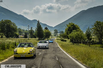 front three-quarter, yellow on a country road