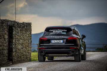 Porsche Cayenne Platinum Edition – rear view, black on a country road