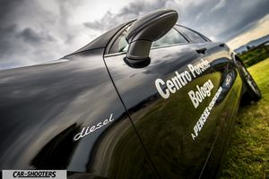 Porsche Cayenne Platinum Edition – side profile, black on a grassy field