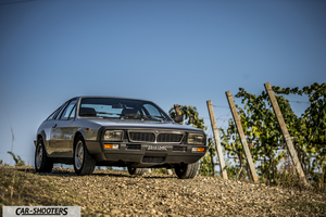 Lancia Beta Montecarlo – front three-quarter, grey metallic on a gravel road
