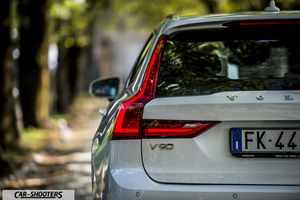 Volvo V90 T8 – rear three-quarter, white on a country road