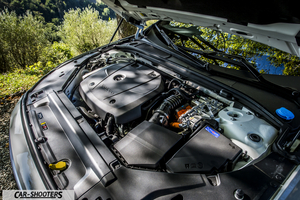 Volvo V90 T8 – engine bay, against a natural outdoor backdrop