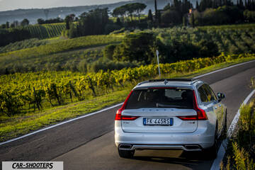Volvo V90 T8 – rear three-quarter, silver on a country road