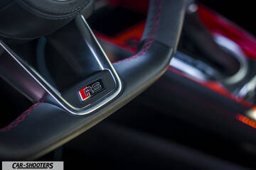 Audi – interior, leather steering wheel with red stitching
