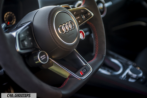 Audi – dashboard, leather steering wheel with red stitching