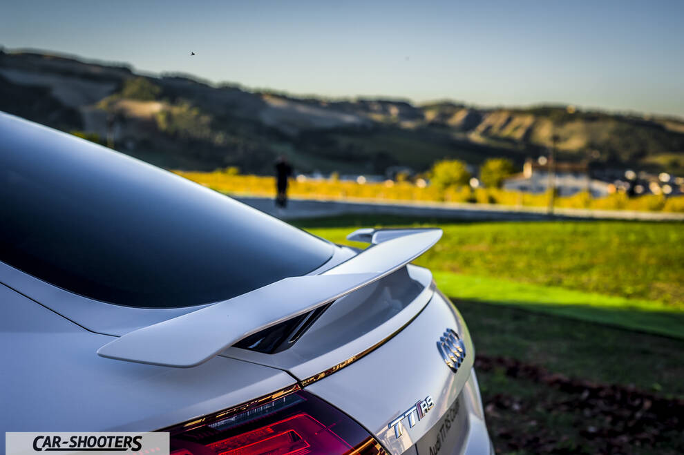 Audi – rear three-quarter, white against a hilly landscape